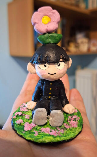 Air-dry clay figure painted with acrylics