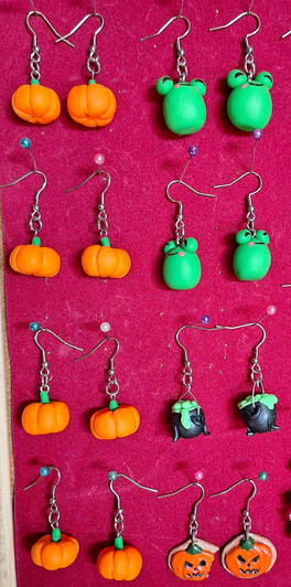 Earrings made with air-dry or polymer clay and painted/detailed with acrylics
