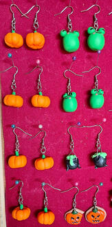 Earrings made with air-dry or polymer clay and painted/detailed with acrylics